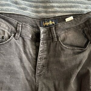 These are very stretchy light black jeans with distressed ankle,no other holes.